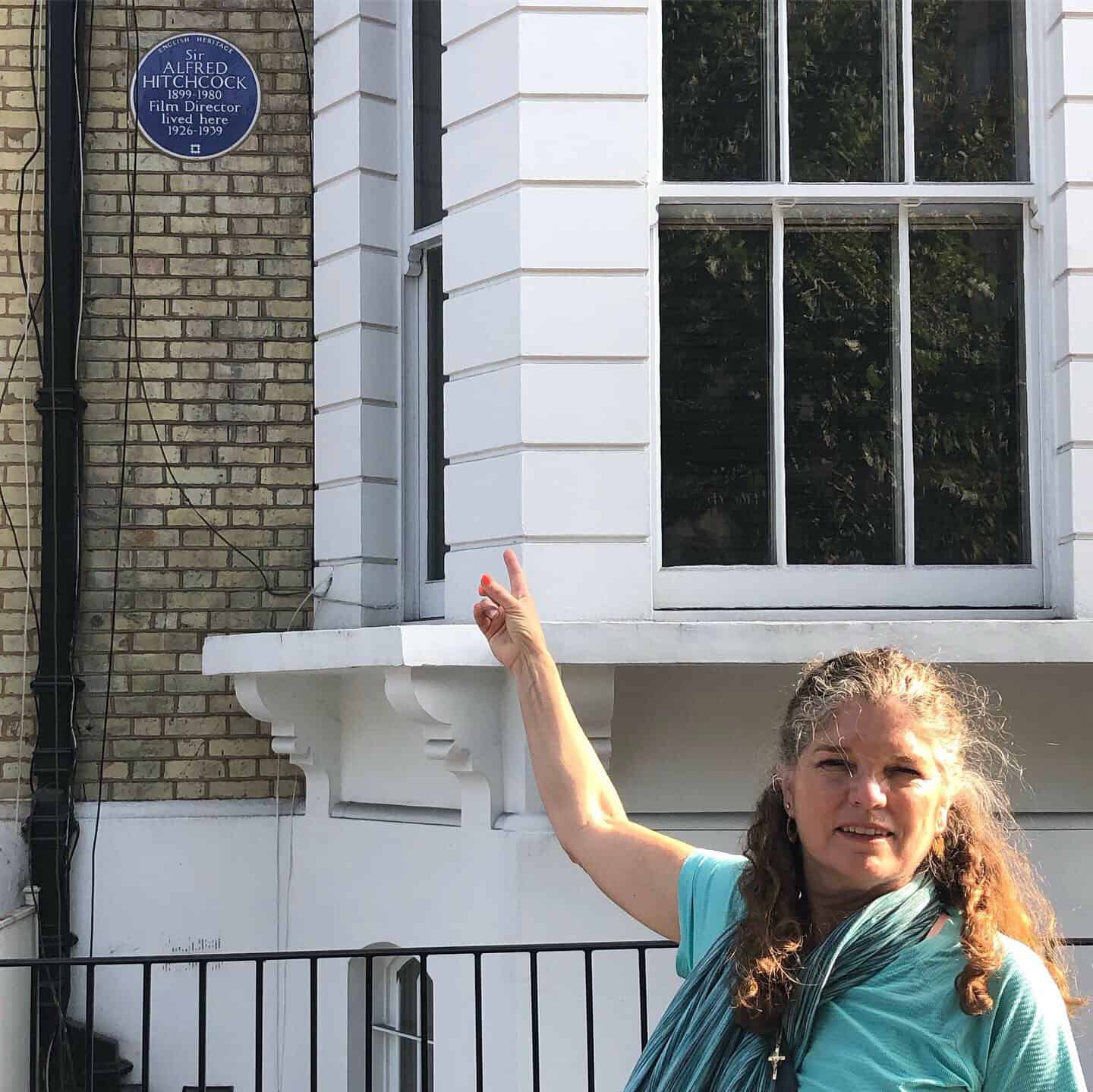 Standing outside the former residence of Sir Alfred Hitchcock in London