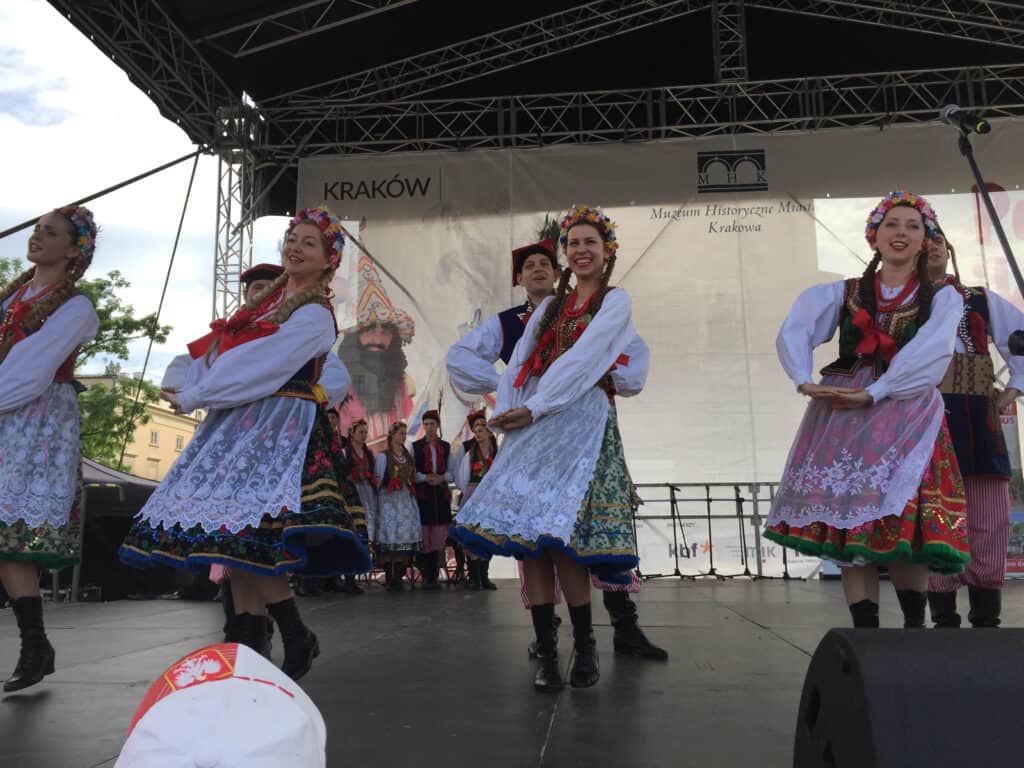 Traditional Polish folk dancers on the great Market Square in Krakow Poland