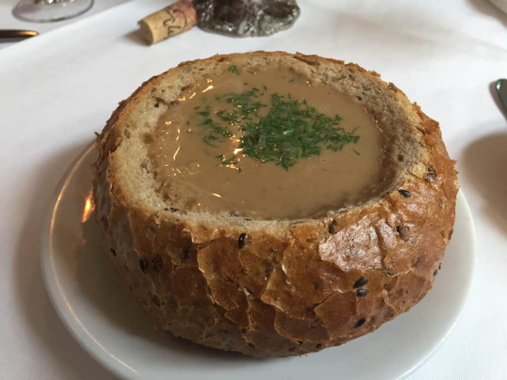 Forest mushroom soup in bread bowl - Pod Baranem in Krakow Poland.
